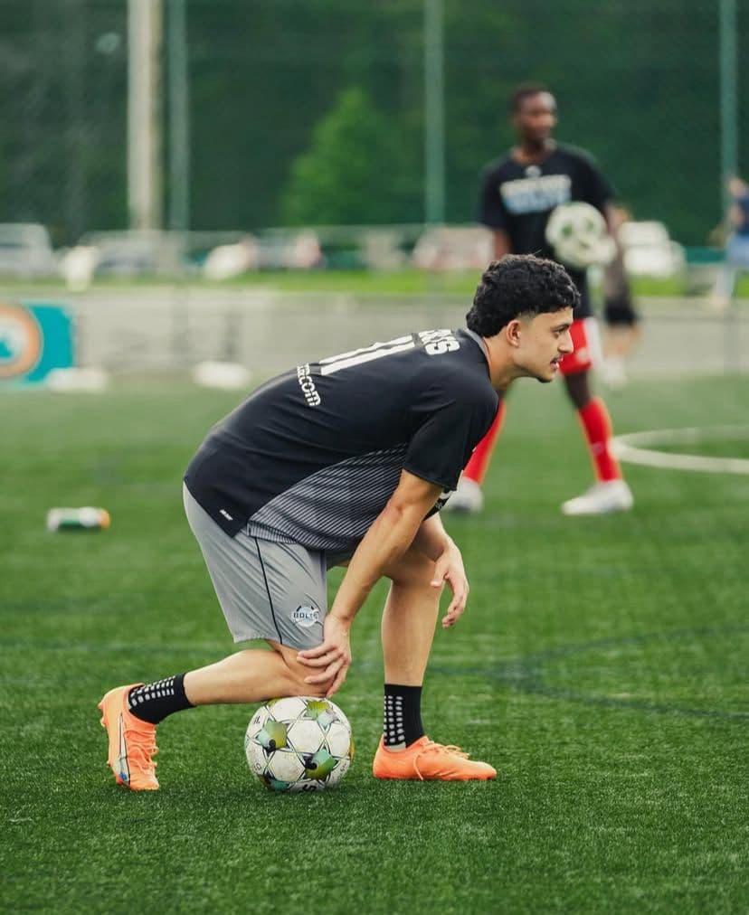 Coach Gabriel Padilla training on the soccer field.